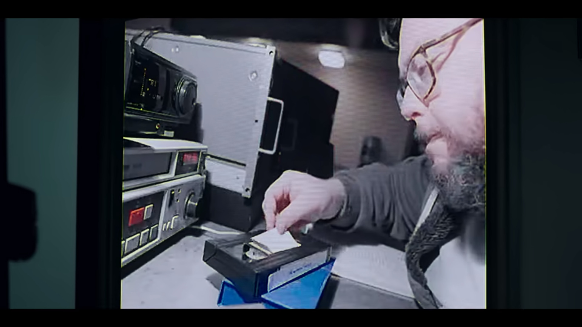 archivist applying label to tape